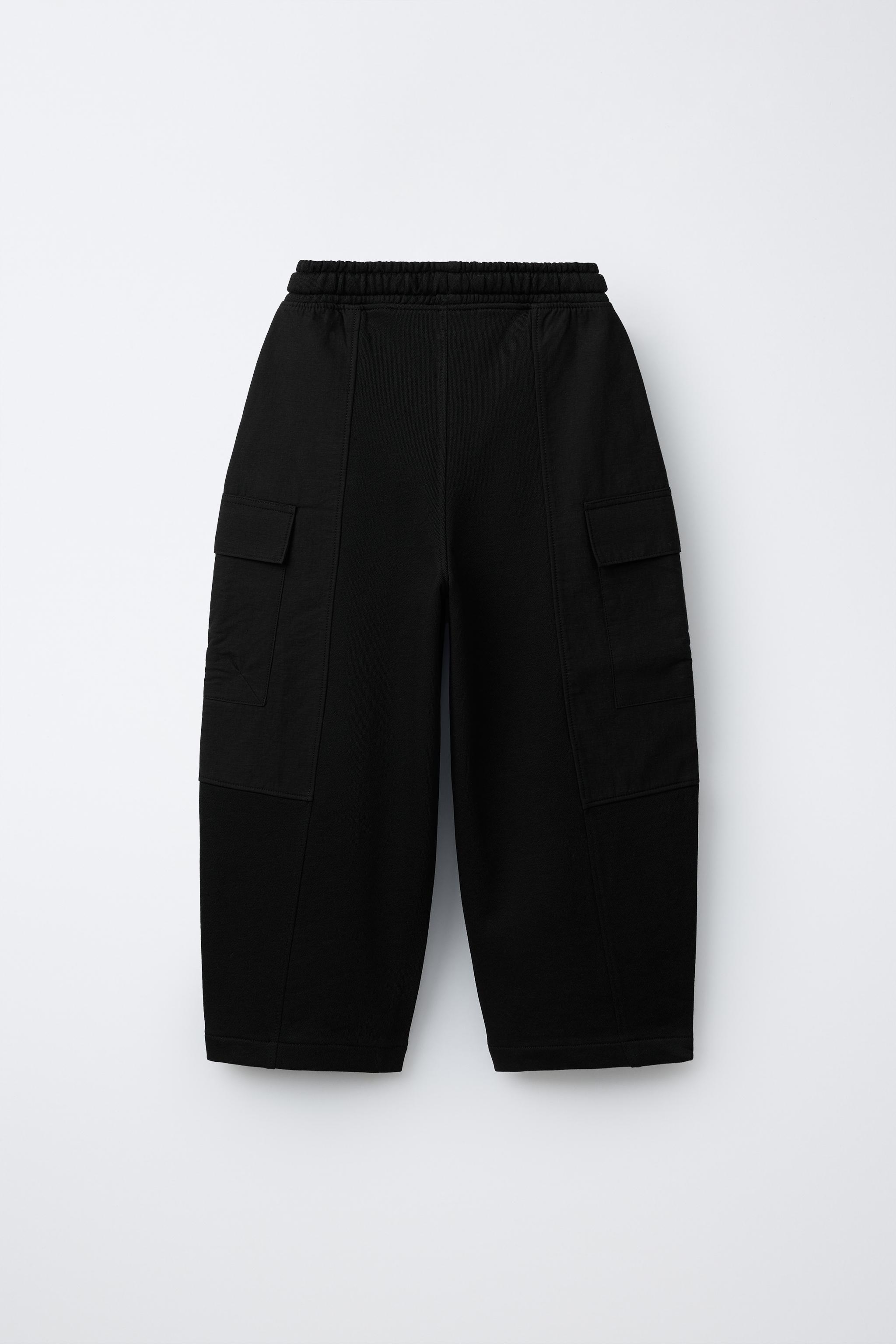PANTALON EN MATIÈRES VARIÉES AVEC ÉTIQUETTE